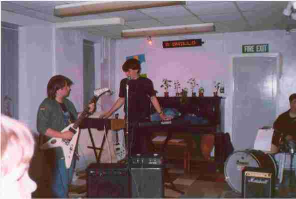 Paul Gooding and me playing at our first ever gig, October 1991